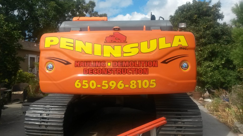 Peninsula Hauling's huge excavator on a job in Pacifca.